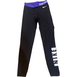 Nike pro leggings. Black with purple trim.